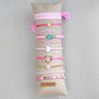 Display cushion with 10 white bracelets
