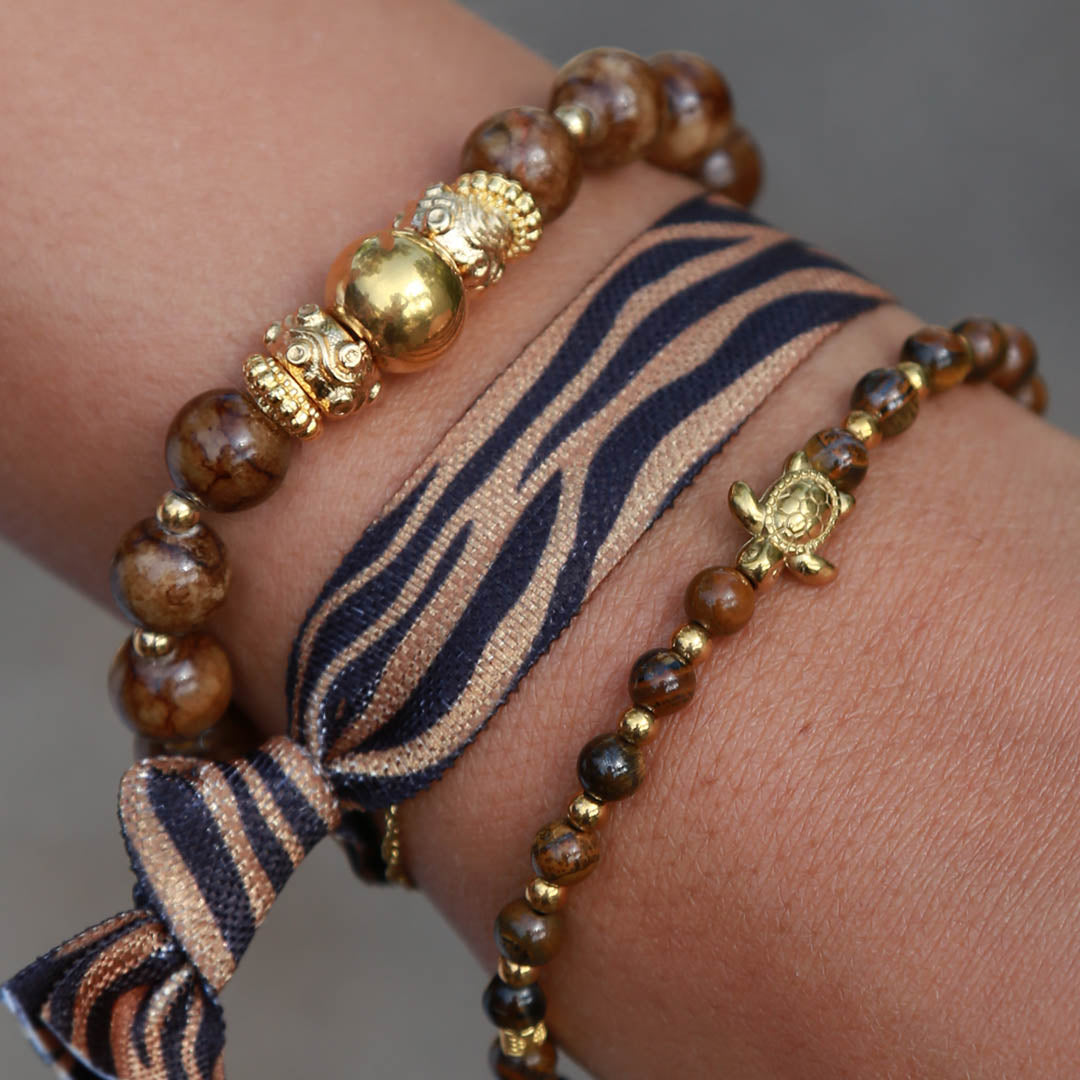 Bracelet boule dorée et pierre brune