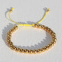 Armband gouden kraal lila