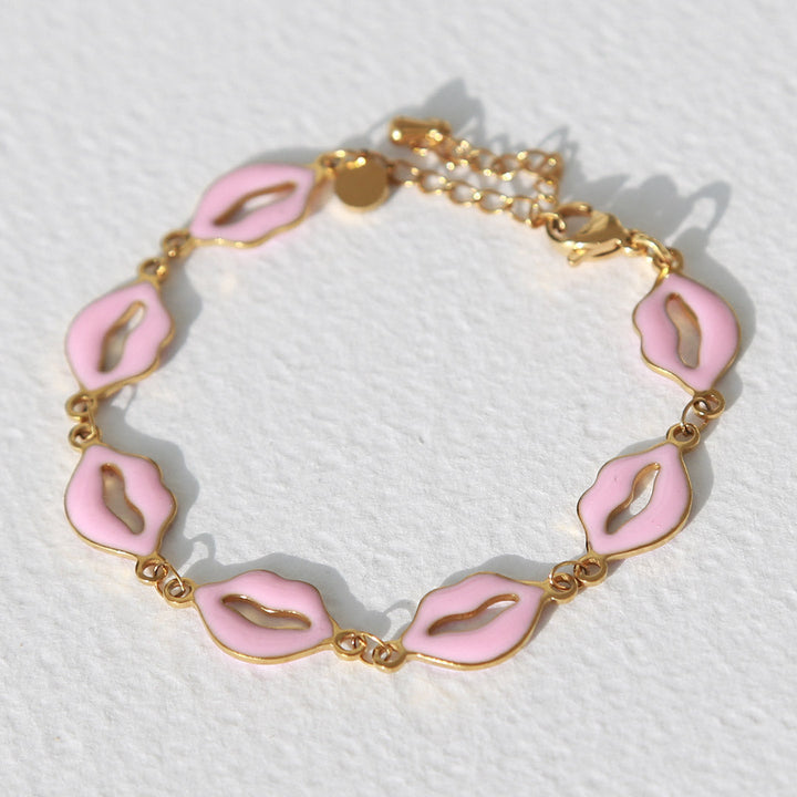 Armband pink lips goud