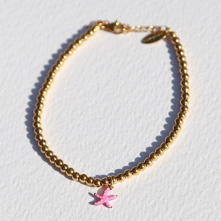 Gouden enkelbandje zeester roze