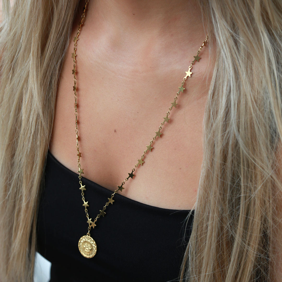 Gouden lange ketting maan en zon