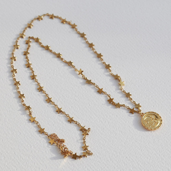 Gouden lange ketting maan en zon