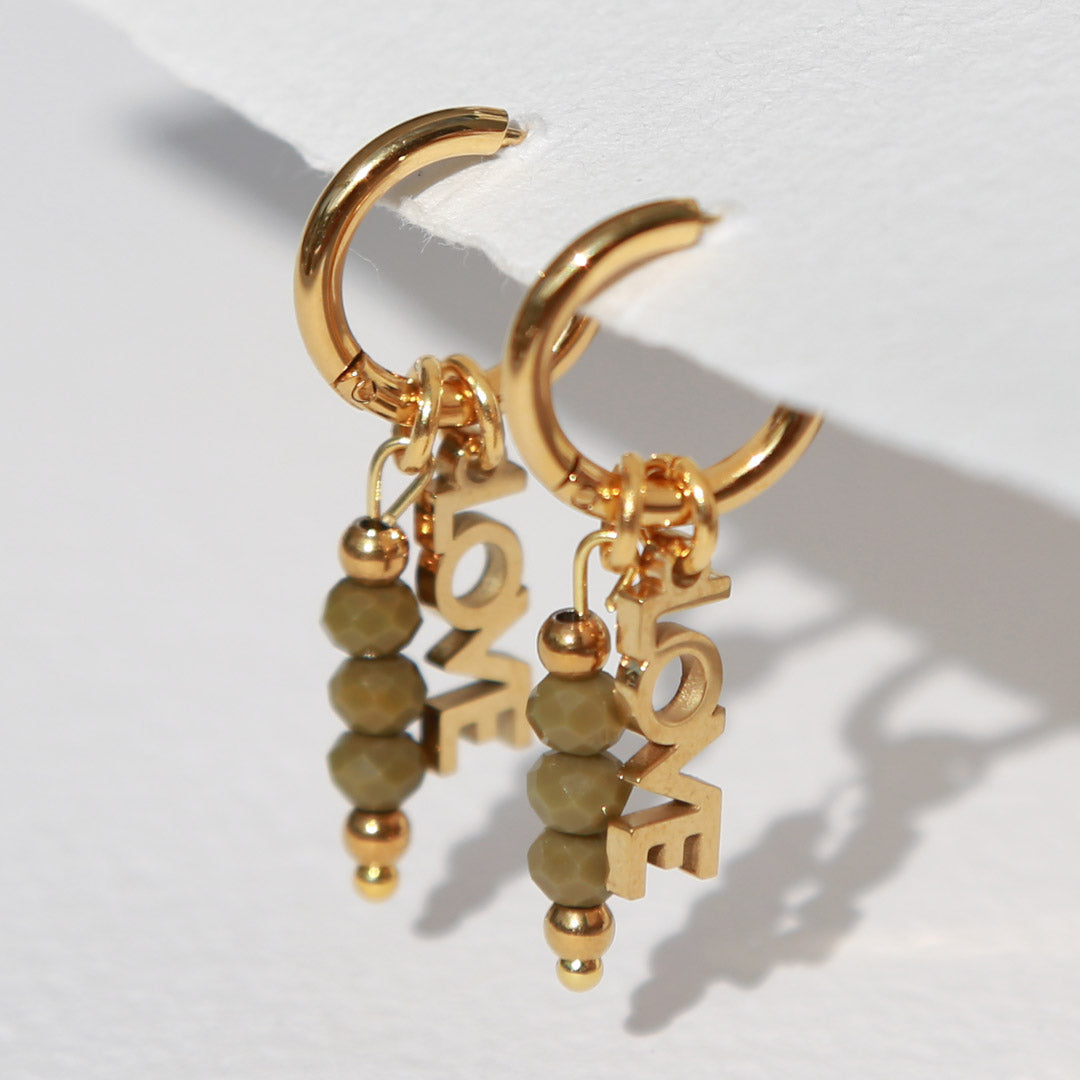Goldene Ohrringe facettiert Liebes oliven