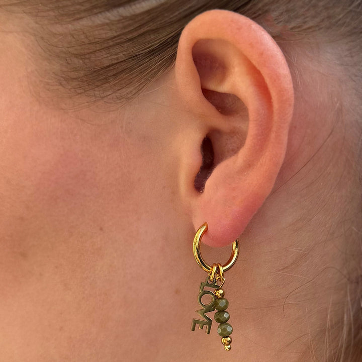 Goldene Ohrringe facettiert Liebes oliven