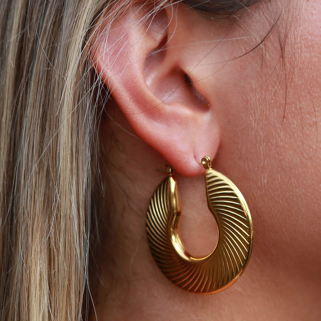 Golden earrings flat lines